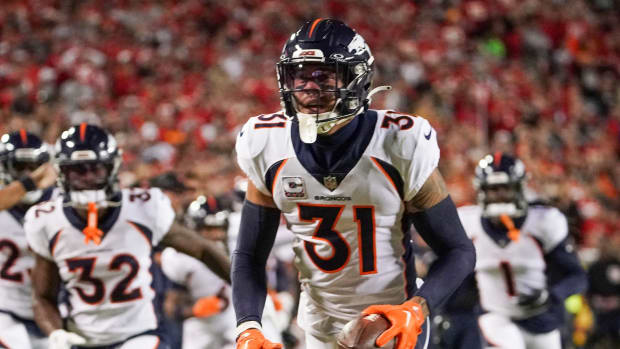 Oct 12, 2023; Kansas City, Missouri, USA; Denver Broncos safety Justin Simmons (31) celebrates after making an interception against the Kansas City Chiefs during the first half at GEHA Field at Arrowhead Stadium.